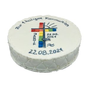 Runde Kommunionstorte mit buntem Kreuz und Fisch