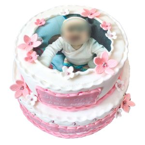 Zweistöckige Kommunionstorte mit Bild, rosa und weißen Blütenverzierungen