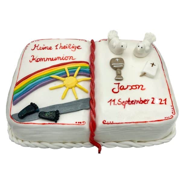 Kommunionstorte "Buch" mit Regenbogen, Sonne, Füßen, Tauben, kleiner Bibel und Kelch modelliert aus Fondant