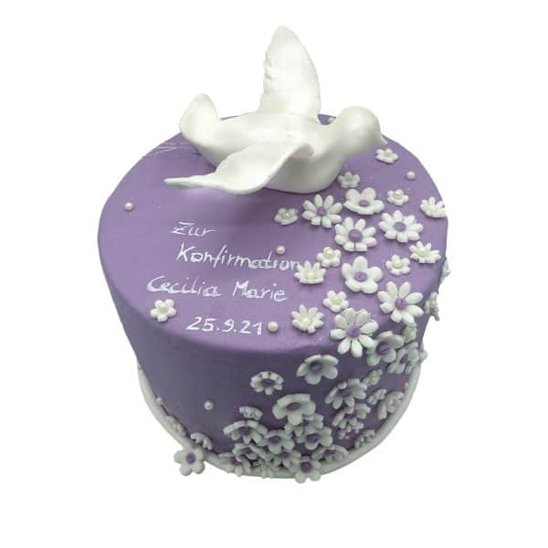 Runde Kommunionstorte mit Blumen und modellierter Taube