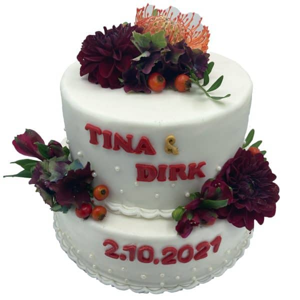 Hochzeitstorte zweistöckig Blumen und Hagebutten