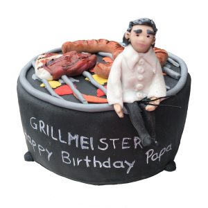 Torte Grill mit Grillmeister und Grillgut